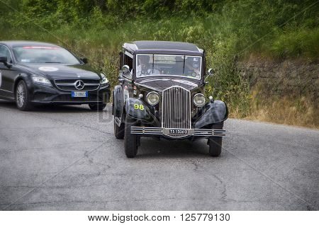 PESARO, ITALY - MAY 15: LANCIA Augusta Berlina 1934 on an old racing car in rally Mille Miglia 2015 the famous italian historical race (1927-1957) on May 2015