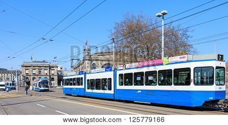 Zurich, Switzerland - 11 April, 2016: trams on the Bahnhofbruecke bridge. Trams have been a consistent part of Zurich's cityscape since the 1880s when the first horse tram ran, electrified from the 1890s.