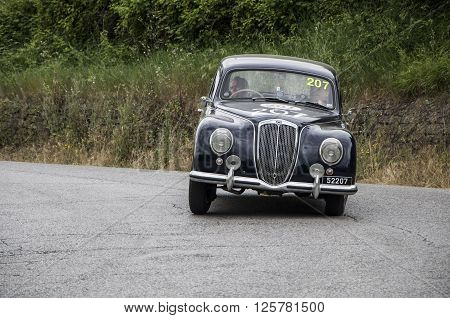 PESARO, ITALY - MAY 15: LANCIA Aurelia B21 Berlina 1951 on an old racing car in rally Mille Miglia 2015 the famous italian historical race (1927-1957) on May 2015