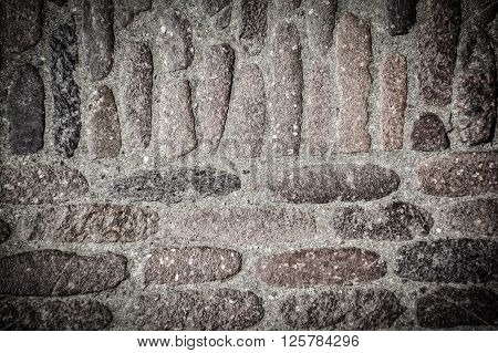 Stone wall pavement texture background. Vintage effect