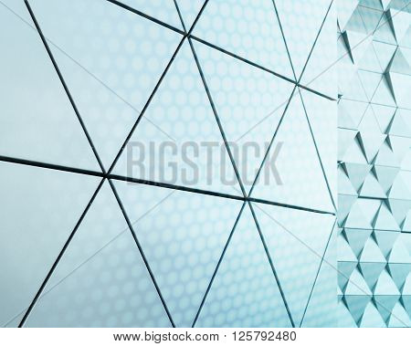 Abstract close-up view of modern aluminum ventilated facade of triangles