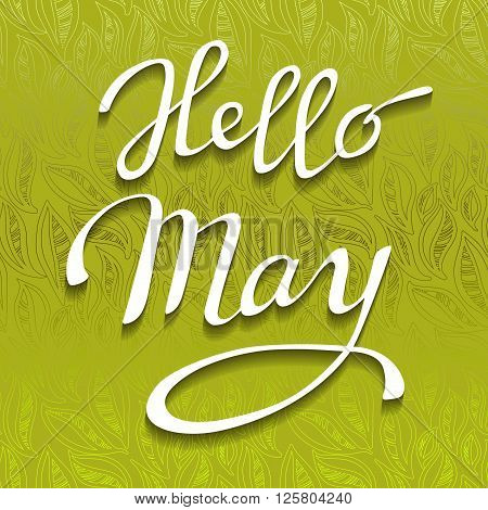 Hand drawn spring calligraphy prase - hello May. Light green abstract leaves pattern background and brush painted white letters. Greeting or invitation card. Vector illustration.
