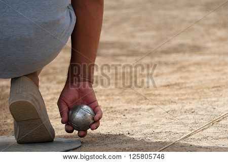 Senior playing petanque fun and relaxing game