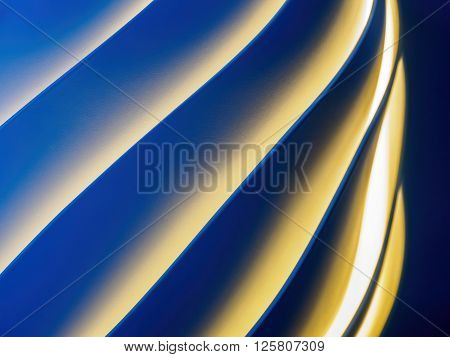 Colored spiral pattern with white, orange and blue lighting.