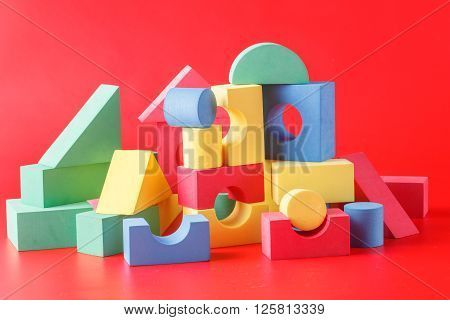 toy castle from color blocks on a red background