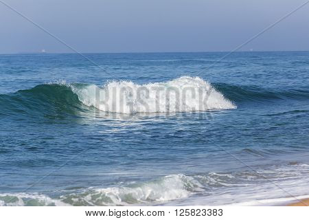 Beach ocean small wave on shoreline coastline landscape.