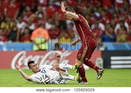 RIO DE JANEIRO BRAZIL - June 18 2014: Gary MEDEL of Chile Fernando TORRES of Spain during the 2014 World Cup. Spain is facing Chile in the Group B at Maracana Stadium