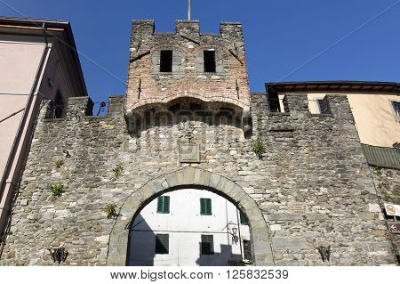 Entrance gate of the medieval town Barga in Lucca province Tuscany Italy