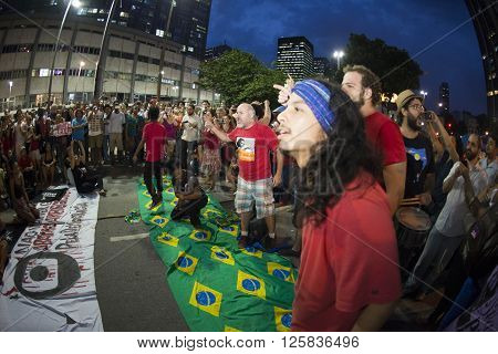 Rio de Janeiro Brasil - March 31 2016: Party workers and social movements are protests in defense of democracy and against the impeachment of President Dilma in the city center in Largo da Carioca
