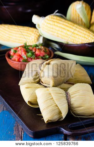 Latin American food. Traditional homemade humitas of corn and leaves