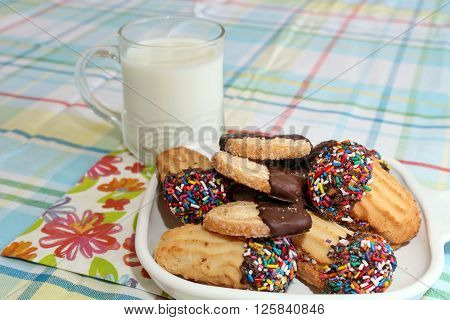 Cookies with sprinkles and a glass of milk