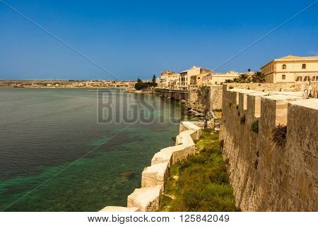The city of Siracusa in Sicily blue bay.