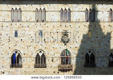Facade of the palace of old people (Palazzo degli Anziani o di Giano) Town Hall of Pistoia Tuscany Italy - XIII - XIV century