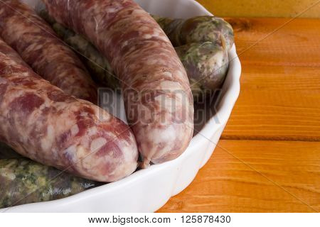 Assorted pork sausages on a wooden table