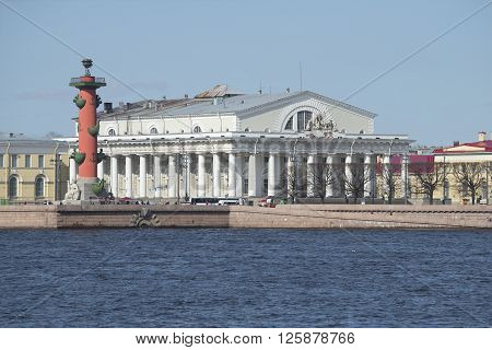 ST. PETERSBURG, RUSSIA - MAY 04, 2015: South Rostral column and stock exchange building on the Spit of Vasilievsky island sunny may day. The landmark of St. Petersburg