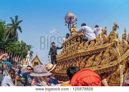 CHIANG MAI THAILAND - APRIL 13: Buddha Phra Singh of Phra Singh temple was moved to the parade cars for pour water in Songkran festival on April 13 2016 in Chiang Mai Thailand.