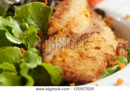 Salad and fried fish