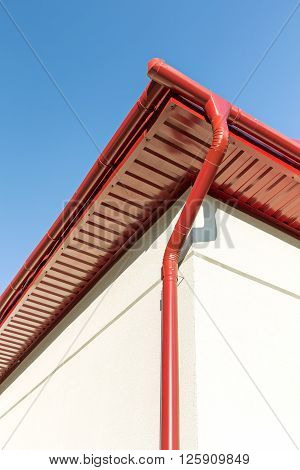 Downspout On Corner Of House