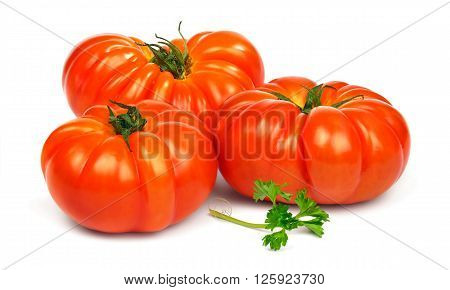 Fresh ripe red tomatoes Timento and a sprig of parsley  isolated on white background.