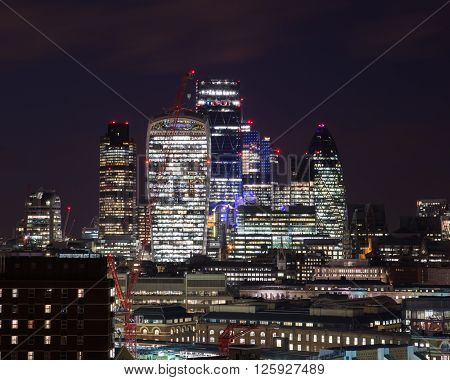 LONDON UK - 26TH MARCH 2015: Buildings in the City of London at night.