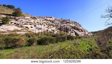 View of the Necropolis of Realmese. Necropoli Pantalicana is an achaeological park in Calascibetta Sicily