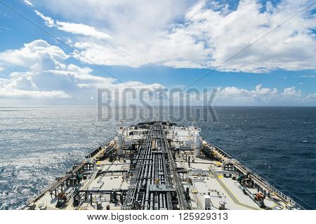 Grey oil tanker deck in the ocean - airview