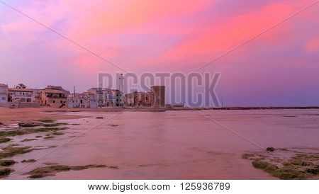 Sunrise at Punta Secca Beach with the lighthouse and the watchtowerTorre Scalambri in Santa Croce Camerina Sicily Italy
** Note: Visible grain at 100%, best at smaller sizes