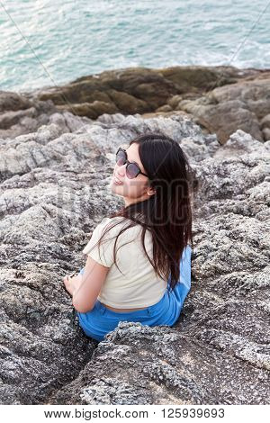 Girl at reef on background of the bay Puket in Thailand