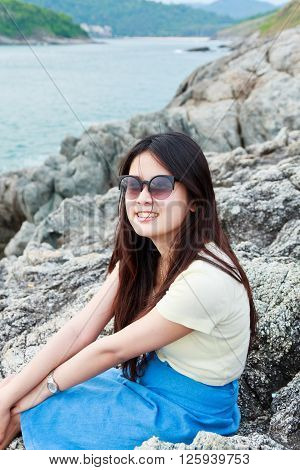 Girl at reef on background of the bay Puket in Thailand