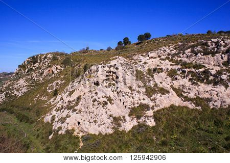 View of the Necropolis of Realmese. Necropoli Pantalicana is an achaeological park in Calascibetta Sicily