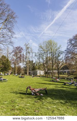 People Enjoy Relaxing In The Outdoor Area Of The  Palmengarten In Frankfurt.