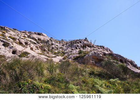 View of the Necropolis of Realmese. Necropoli Pantalicana is an achaeological park in Calascibetta Sicily