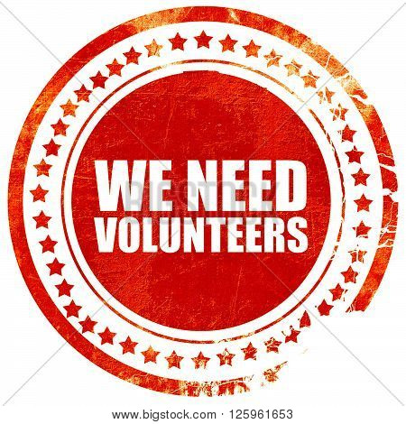 we need volunteers, isolated red stamp on a solid white background