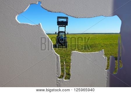 Tractor in a farmer field.Background of agriculture industry
