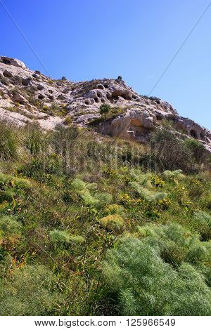 View of the Necropolis of Realmese. Necropoli Pantalicana is an achaeological park in Calascibetta Sicily