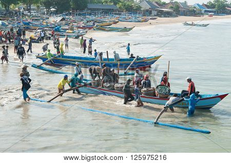 Bali Indonesia Apr 5 2016 : Morning scene of daily activities at Jimbaran village pictured on Apr 5 2016 in Bali Indonesia. Jimbaran village is among famous place to see fisherman life in Bali.