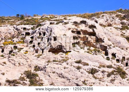 View of the Necropolis of Realmese. Necropoli Pantalicana is an achaeological park in Calascibetta Sicily