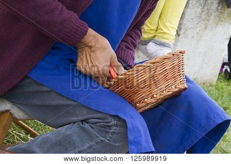 craftman at work with wicker and basket