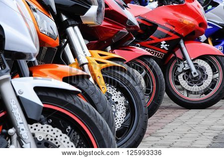KELANTAN, MALAYSIA -JULY 07, 2012: A number of super bike motorcycle parked in rows in the open area and have been exhibited to the public.