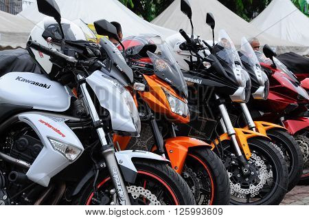 KELANTAN, MALAYSIA -JULY 07, 2012: A number of super bike motorcycle parked in rows in the open area and have been exhibited to the public.