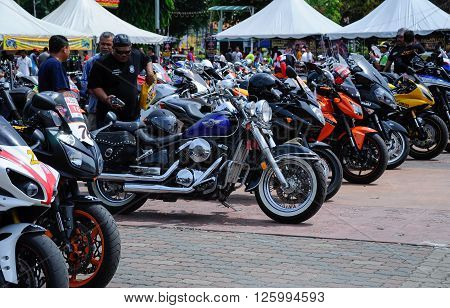 KELANTAN, MALAYSIA -JULY 07, 2012: A number of super bike motorcycle parked in rows in the open area and have been exhibited to the public.