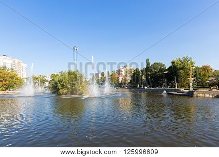 Lipetsk, Russia - September 18, 2014: Komsomolskiy pond with Fountains in sunny day, Lipetsk, Russia