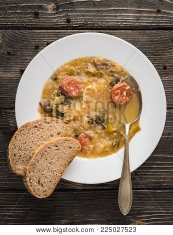 Slovak christmas cabbage soup with mushrooms on natural background.