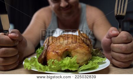 Fat Man Preparing To Eat Greasy Fried Chicken, Holding Knife And Fork, Close-up, Stock Footage