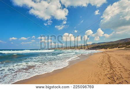 Beautiful wild beach with clear turquoise water and waves. Lara beach, Cyprus.