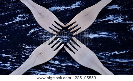 Silver Fork Lying On A Wooden Table.