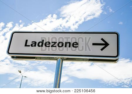 Ladezone - Information sign loading zone in german language - on a light blue background