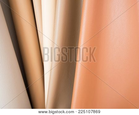 Color palette sample of leather material as a background.