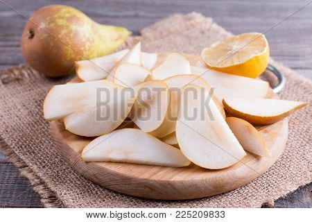 Pear slices on a cutting board on the table