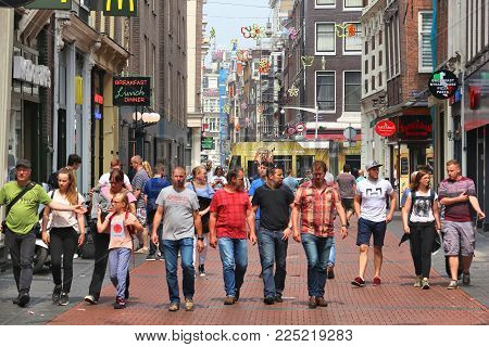 Amsterdam, Netherlands - July 7, 2017: People Visit Nieuwendijk Shopping Street In Amsterdam, Nether